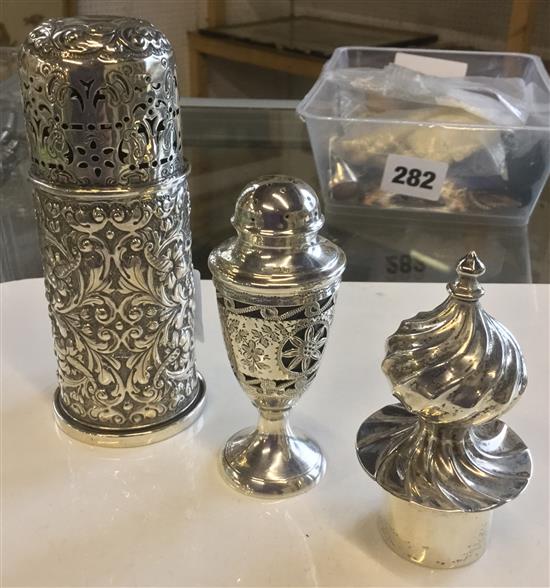 Silver sugar sifter, a pepper pot and a bottle stopper